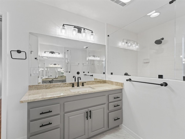 bathroom with vanity and walk in shower