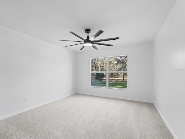 empty room with carpet flooring and ceiling fan