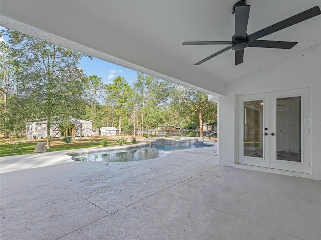 view of swimming pool with a patio area, an in ground hot tub, and french doors