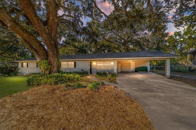 ranch-style house with a carport