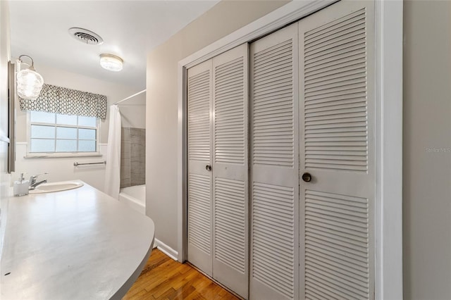 bathroom featuring hardwood / wood-style flooring and sink