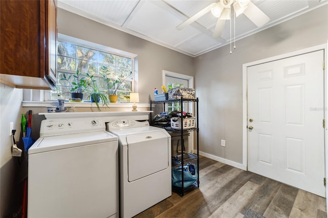 laundry room featuring hardwood / wood-style floors, cabinets, washer and dryer, ceiling fan, and ornamental molding