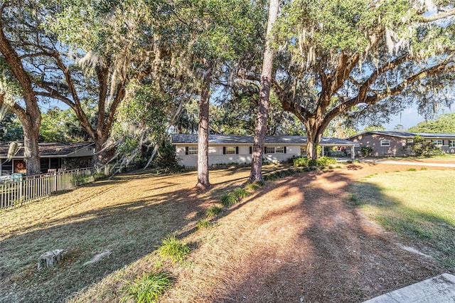 ranch-style house with a front yard