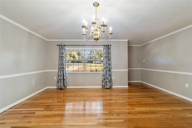 unfurnished dining area featuring an inviting chandelier, ornamental molding, and light hardwood / wood-style flooring