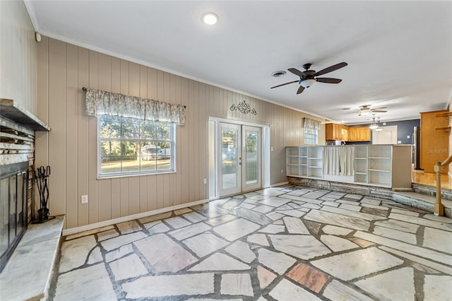 unfurnished living room with crown molding