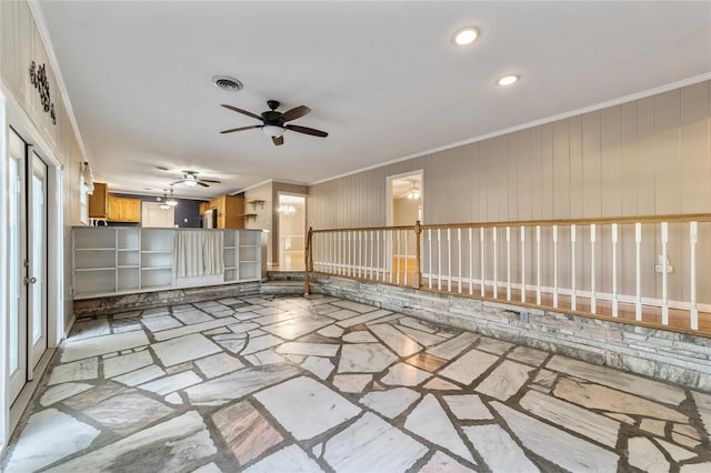 empty room with ceiling fan and ornamental molding