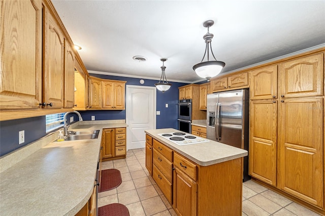 kitchen featuring sink, appliances with stainless steel finishes, decorative light fixtures, a kitchen island, and ornamental molding