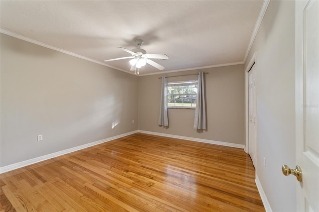 unfurnished room with light hardwood / wood-style floors, ceiling fan, and crown molding