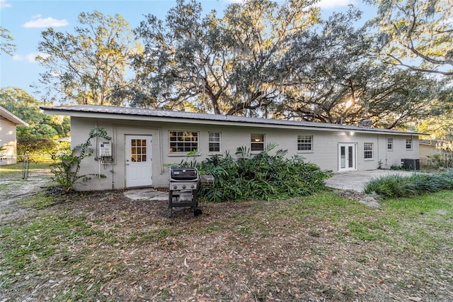 back of house with french doors, a patio, and central air condition unit