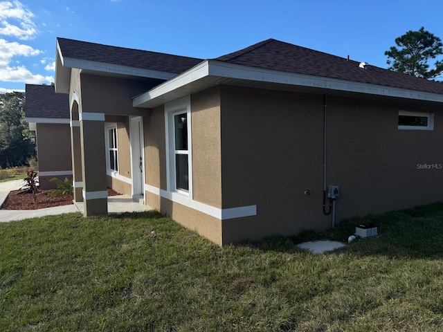 view of home's exterior featuring a lawn