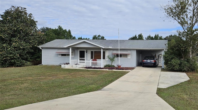 ranch-style home with covered porch, a carport, and a front lawn