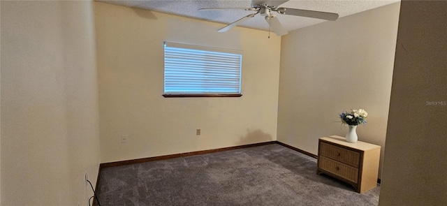 unfurnished room with ceiling fan and carpet flooring