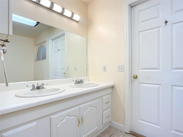 bathroom with tile patterned floors and vanity