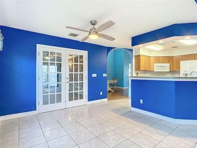 kitchen with ceiling fan, white appliances, light tile patterned floors, and french doors