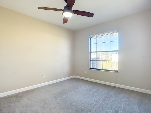 empty room with carpet flooring and ceiling fan