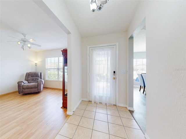 entrance foyer featuring light hardwood / wood-style flooring and ceiling fan