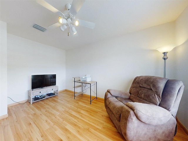 sitting room featuring hardwood / wood-style floors