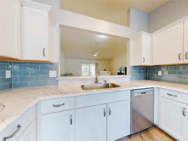 kitchen with dishwasher, white cabinets, light wood-type flooring, and sink