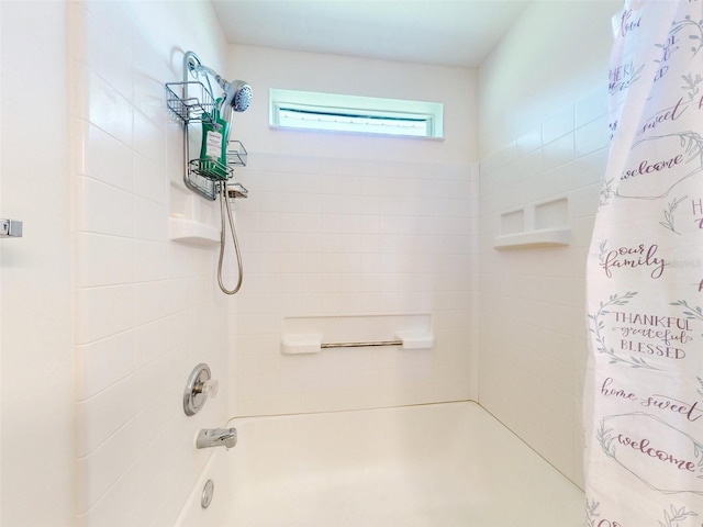 bathroom featuring shower / tub combo with curtain