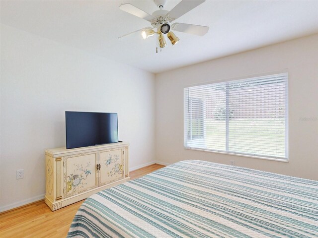 bedroom featuring ceiling fan and light hardwood / wood-style floors