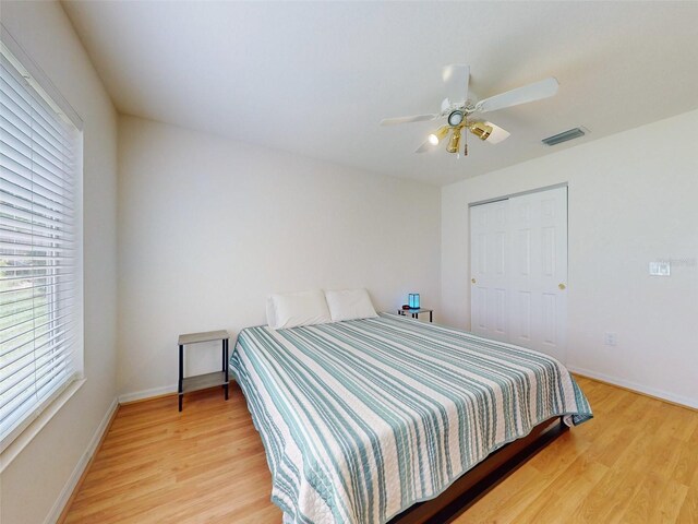 bedroom featuring ceiling fan and light hardwood / wood-style flooring