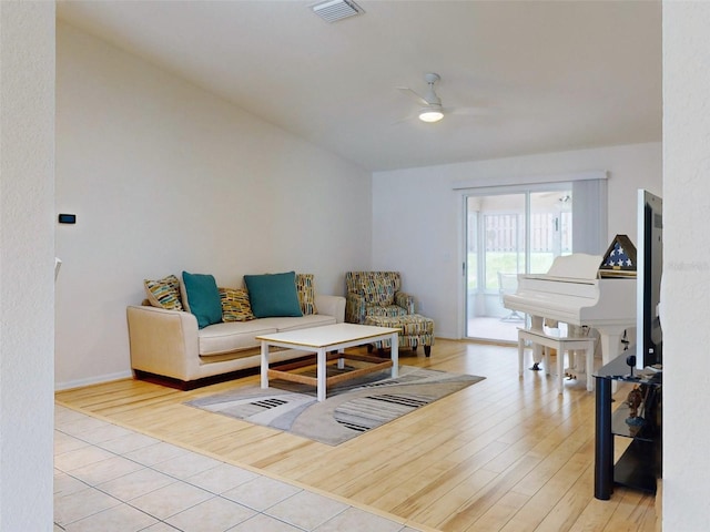 living room featuring light hardwood / wood-style flooring and ceiling fan