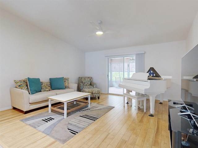 living room featuring hardwood / wood-style flooring and ceiling fan