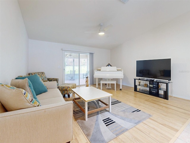 living room with ceiling fan and light hardwood / wood-style floors