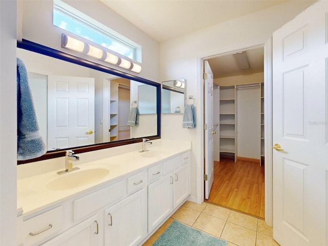 bathroom with tile patterned floors and vanity