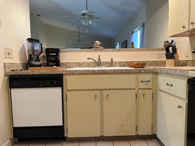 kitchen featuring cream cabinetry, dishwasher, sink, and vaulted ceiling