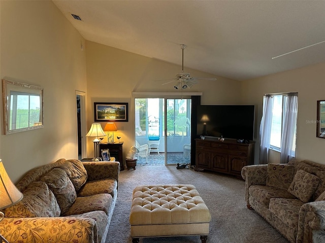 living room with carpet flooring, ceiling fan, and a healthy amount of sunlight