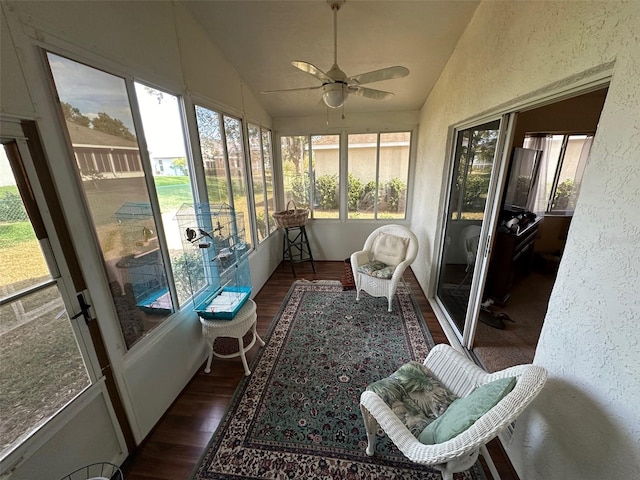 sunroom featuring ceiling fan, lofted ceiling, and a wealth of natural light