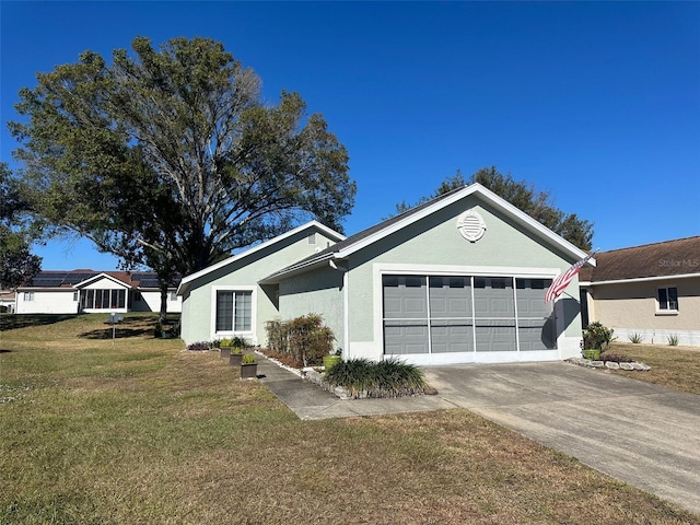 ranch-style home featuring a garage and a front yard