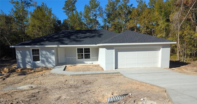 ranch-style home featuring a garage