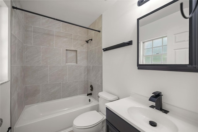 full bathroom featuring vanity, toilet, and tiled shower / bath