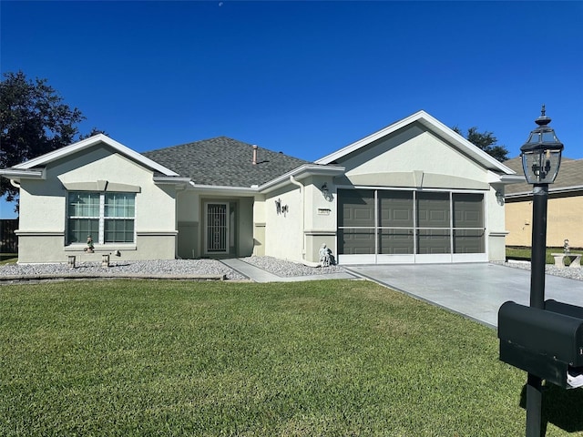 single story home with a front lawn and a garage