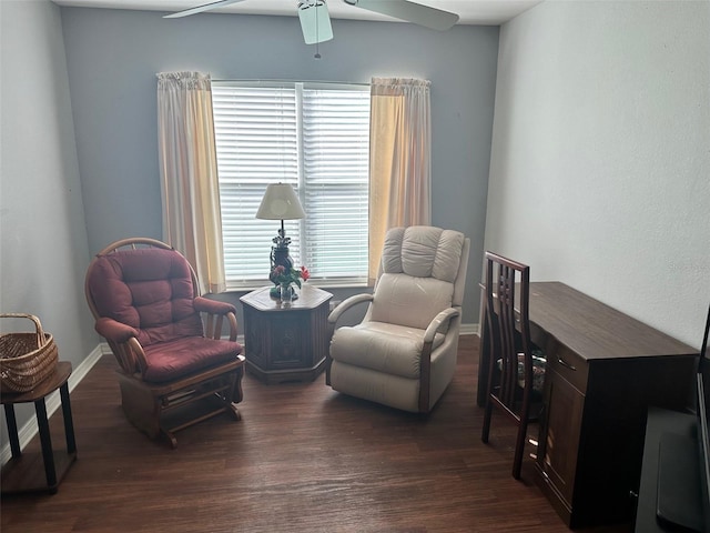 sitting room with dark hardwood / wood-style floors and ceiling fan