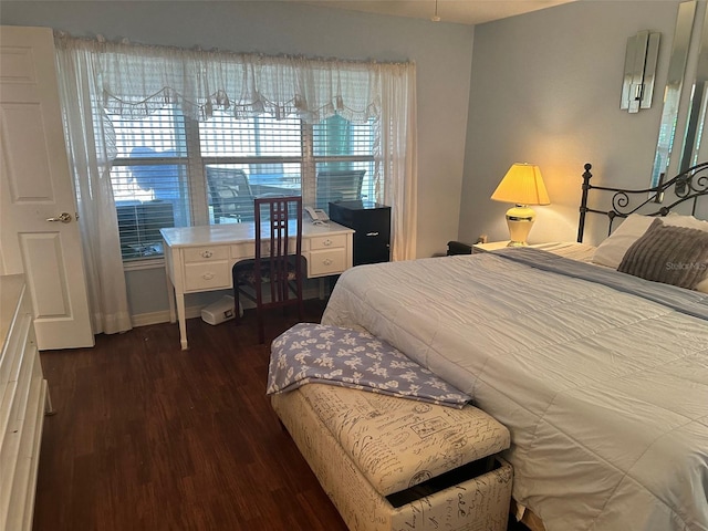 bedroom featuring dark hardwood / wood-style flooring