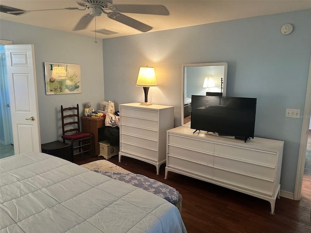 bedroom featuring dark hardwood / wood-style flooring and ceiling fan