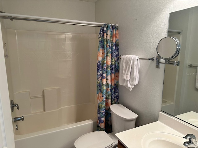 full bathroom featuring vanity, shower / tub combo, and toilet