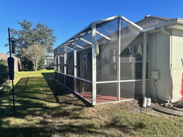 view of side of property with a lawn