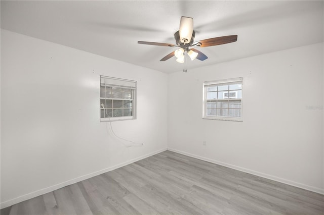 empty room featuring ceiling fan and light wood-type flooring