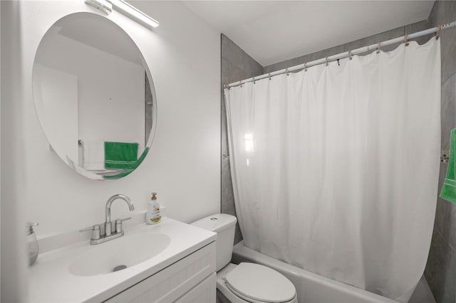 full bathroom featuring shower / tub combo, vanity, and toilet