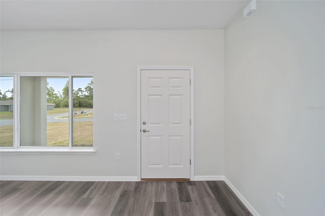 spare room with dark hardwood / wood-style floors