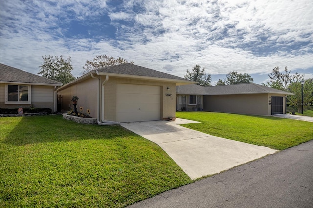 ranch-style home featuring a garage and a front yard