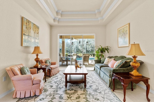 living area featuring ornamental molding, light tile patterned floors, and a tray ceiling