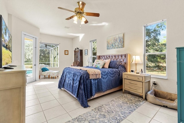 bedroom with access to exterior, light tile patterned floors, and ceiling fan