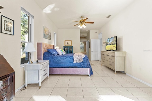 tiled bedroom with ceiling fan