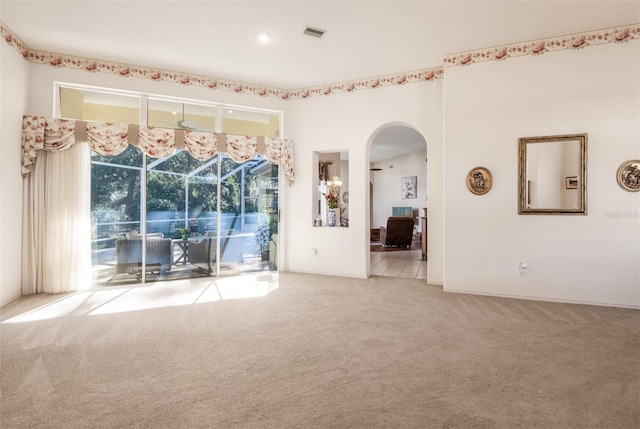 unfurnished room with light colored carpet