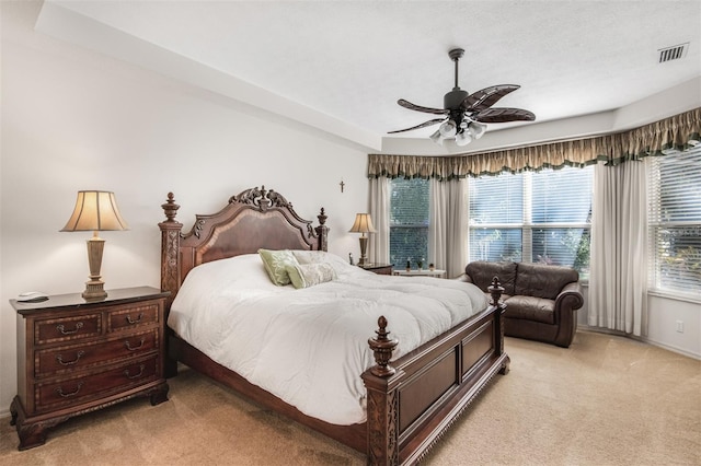 bedroom with light carpet and ceiling fan